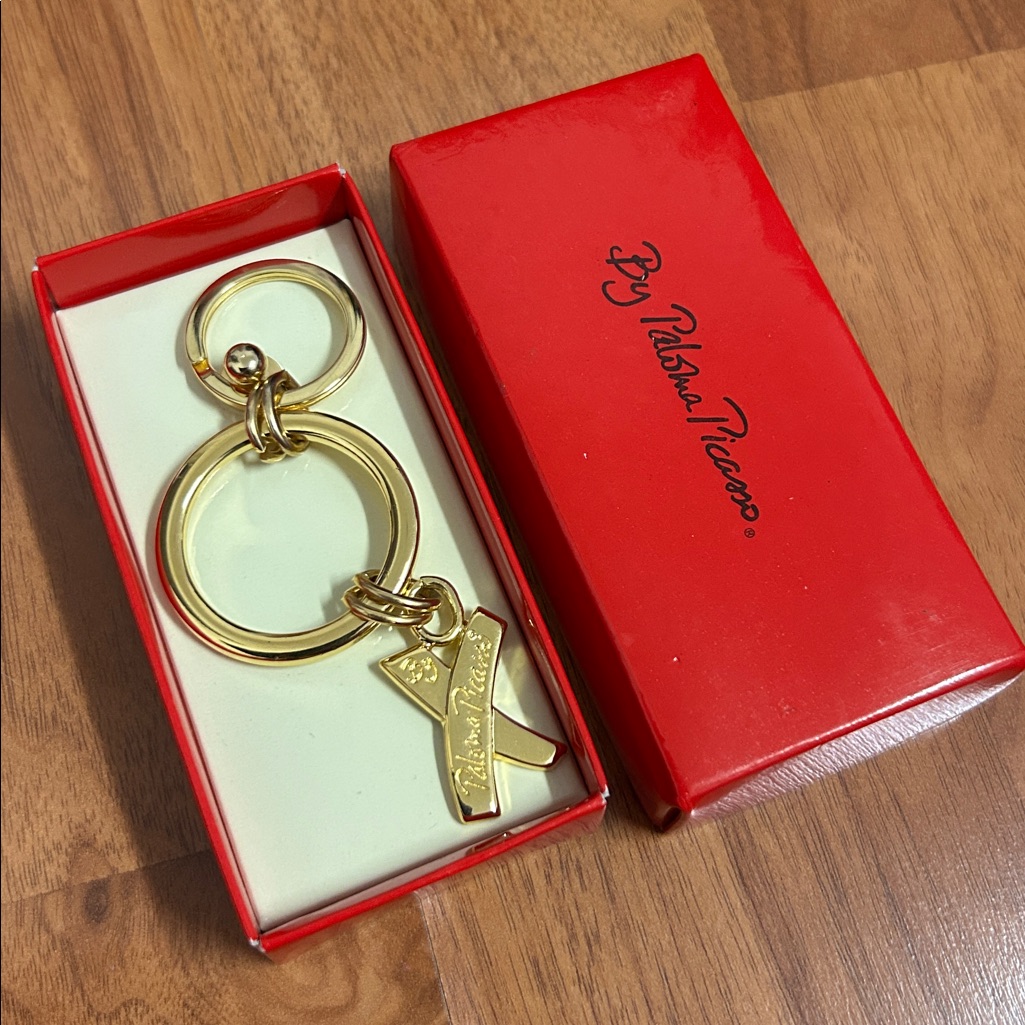 Brand New In Box Paloma Picasso Gold Tone Logo Keychain Brand New In Box Paloma Picasso Gold Tone Logo Keychain
